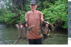 bryson holding 2 sloths
